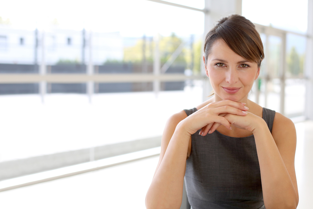 Picture of a professional woman pondering an assessment.